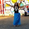 a local dancer helps celebrate the unveiling of Lemoore's newest mural entitled "The Fabric of Our Heritage," Friday afternoon in downtown Lemoore.